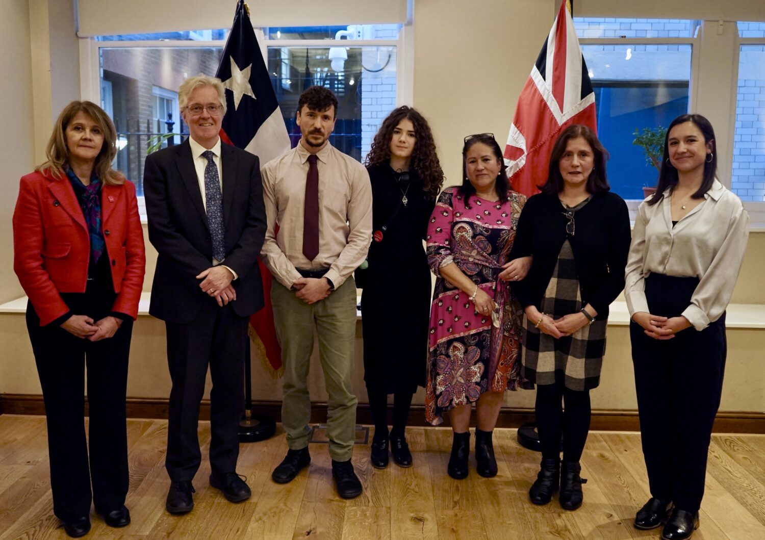 Members of Leopoldo Lucero Garcia with the Ambassador of Chile to the United Kingdom, Ximena Fuentes, and the Undersecretary of Human Rights, Daniela Quintanilla, during the ceremony of apology at the Chilean Embassy in London.
