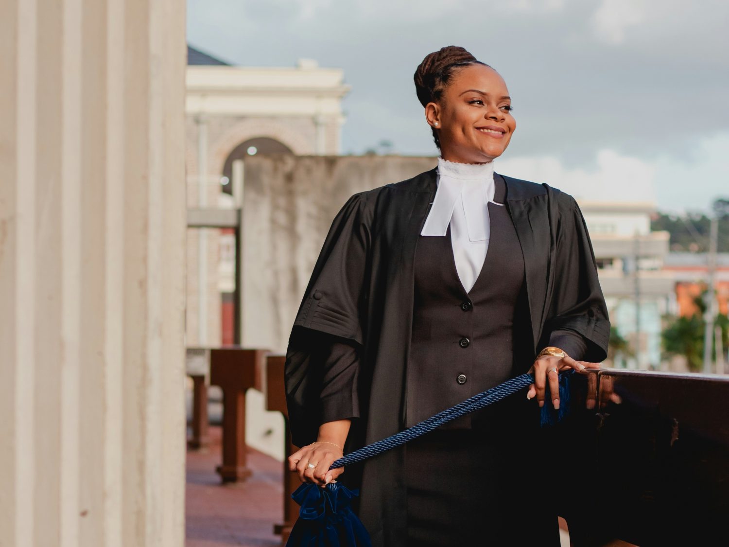 Graduate lawyer looking out over the city.